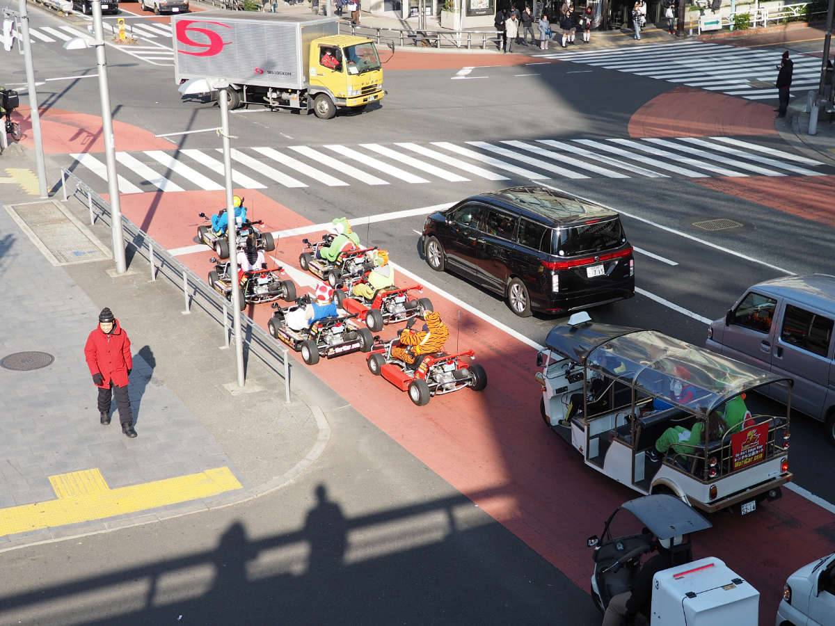 People riding Mario themed Go-karts