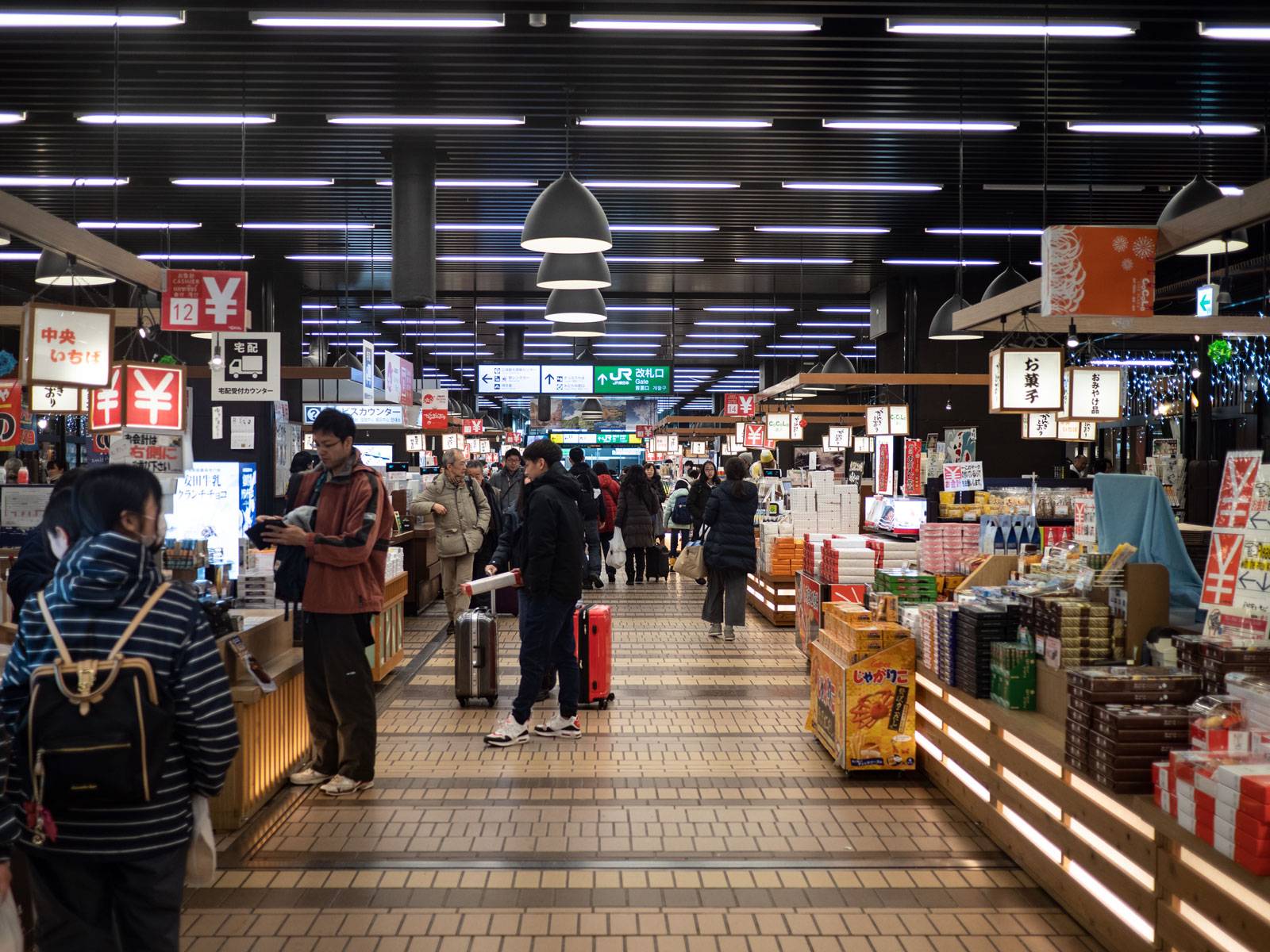 People inside the warm and cozy basement exploring shopping stalls