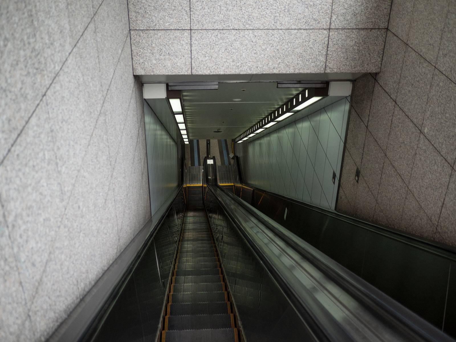 Taking the escalator down to Shinsaibashi subway