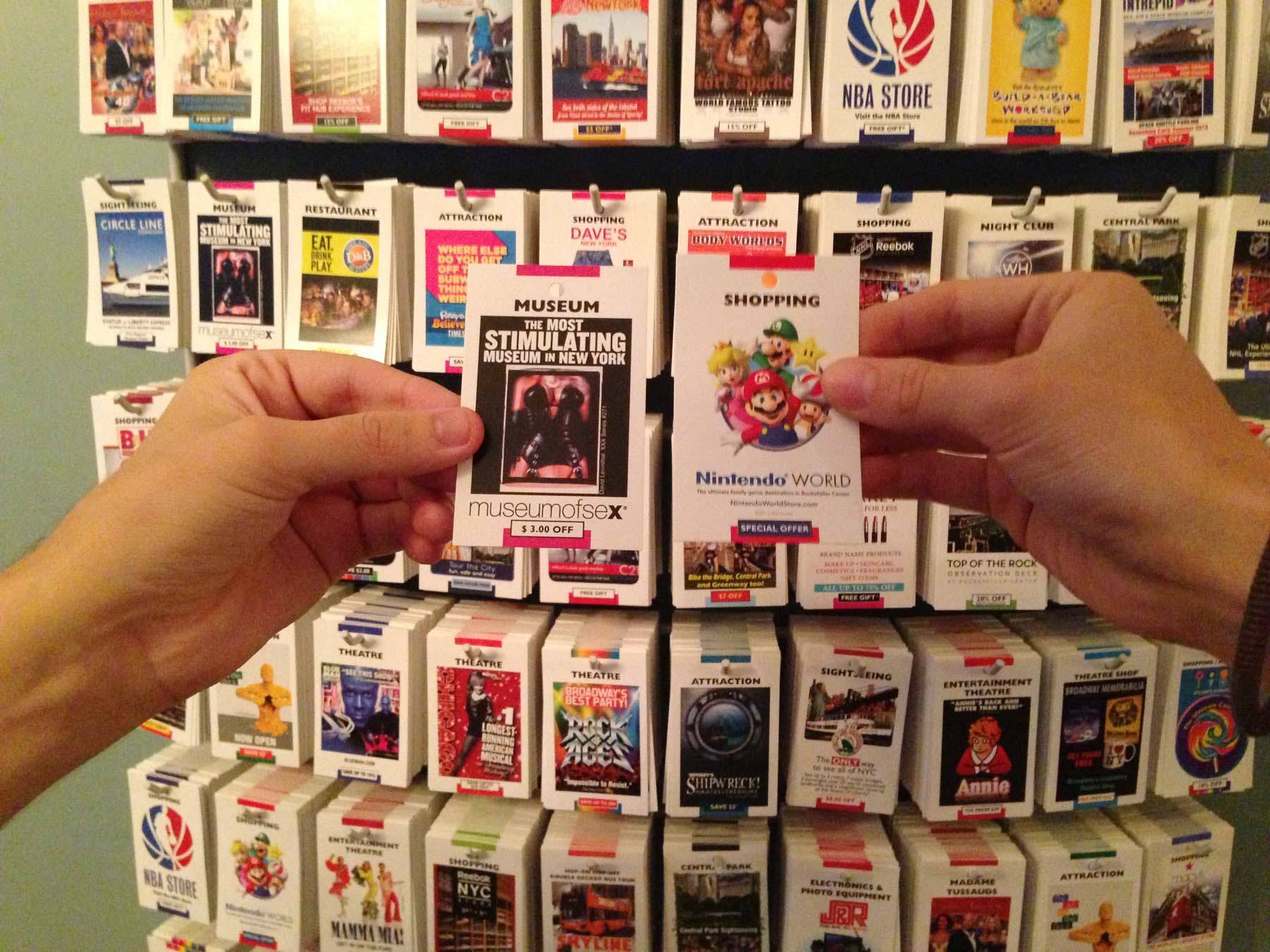 Richard holding a Museum of Sex ad, while I hold a Nintendo World ad
