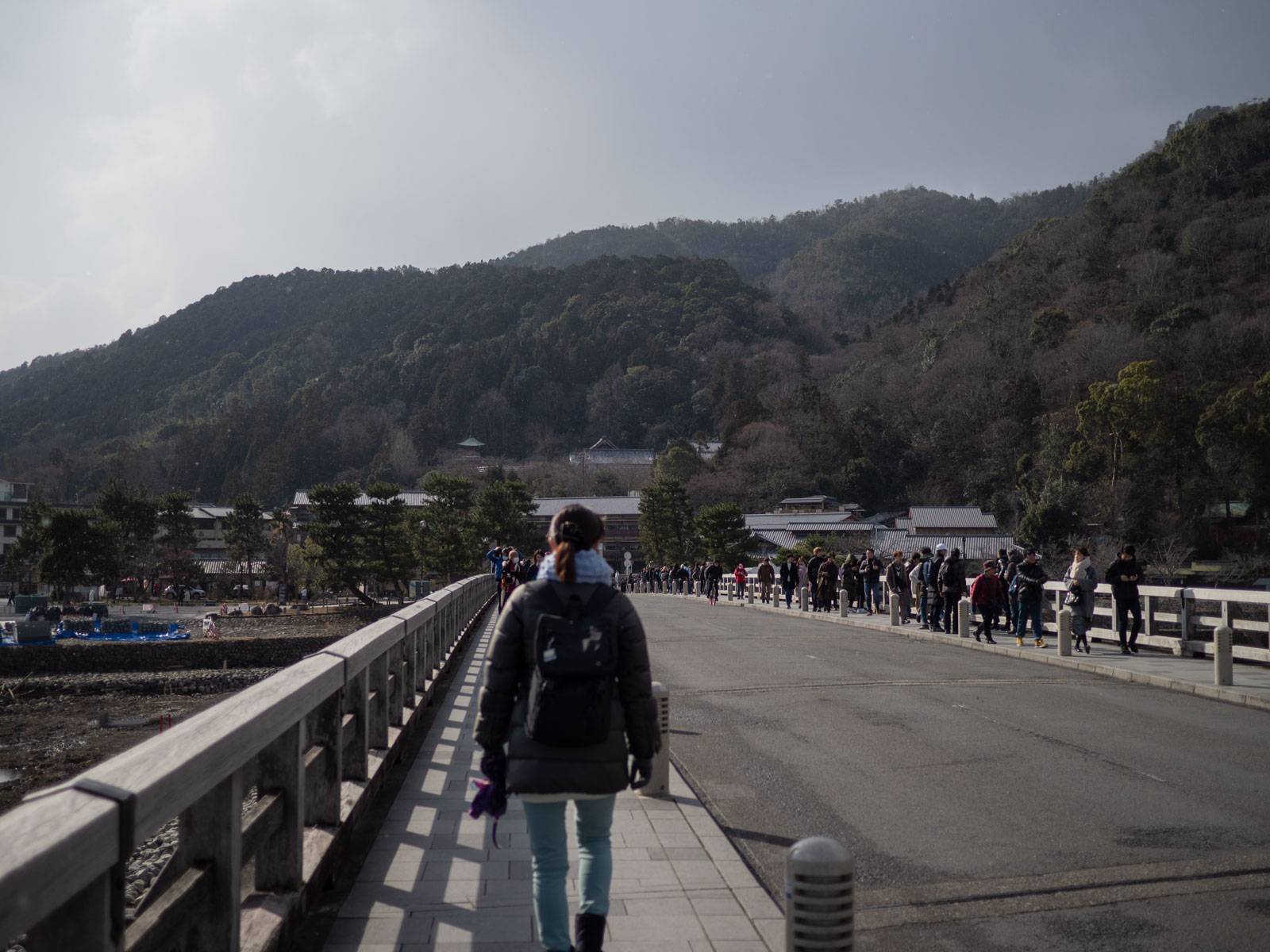 Walking south across Togetsu-kyō Bridge