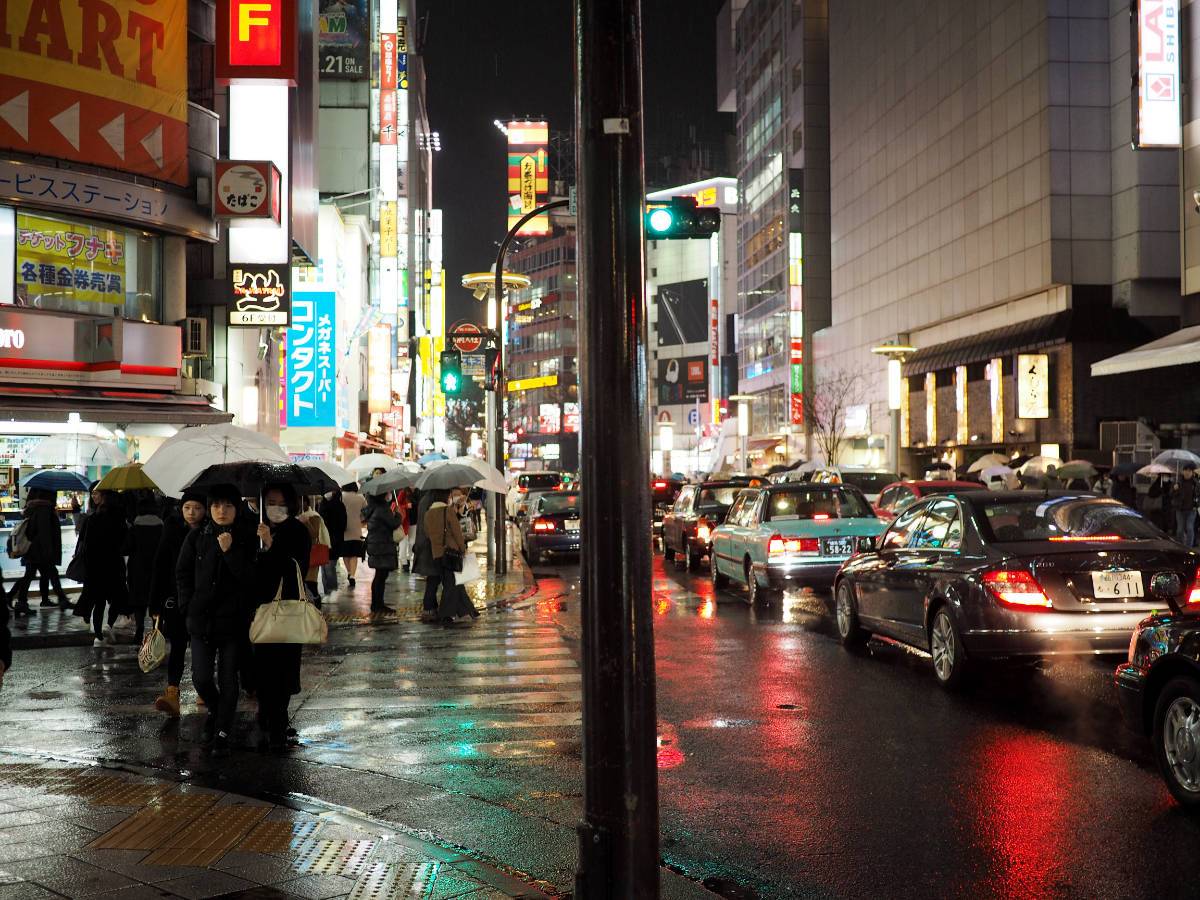 Pedestrians walking in rain