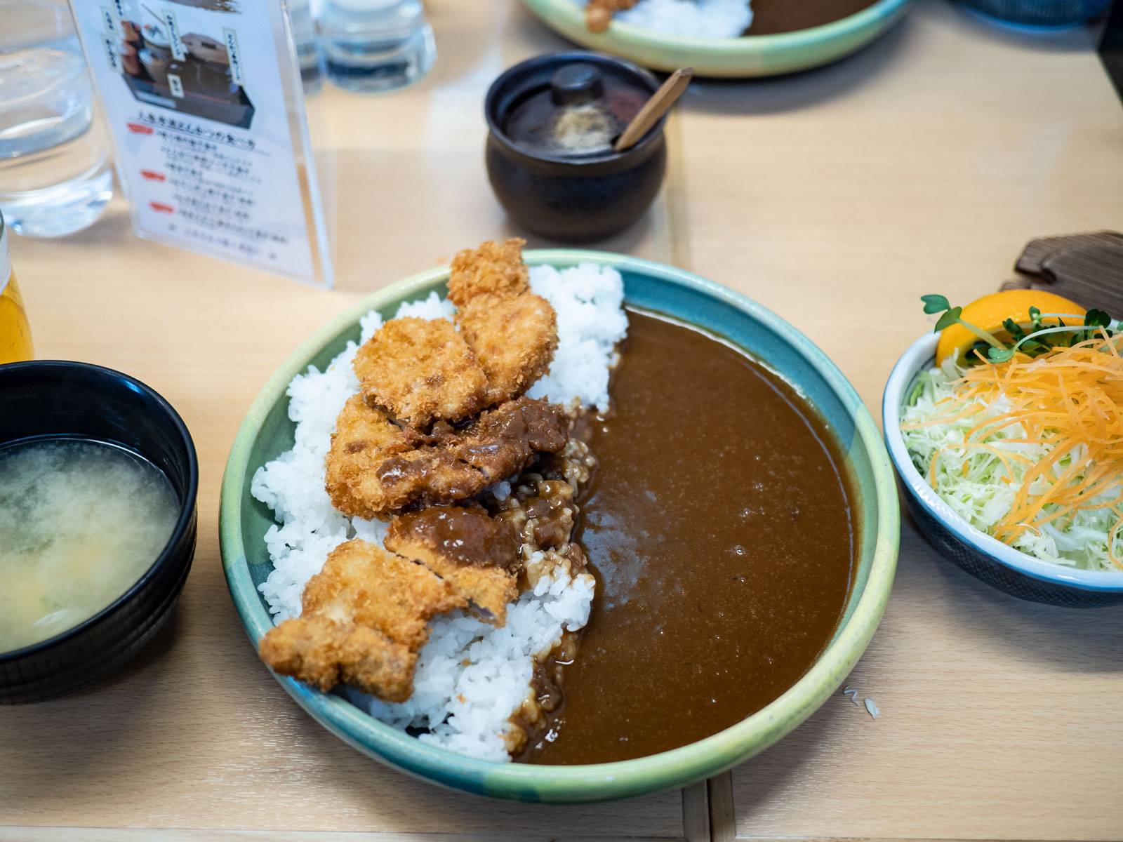 A large bowl of katsu curry and rice