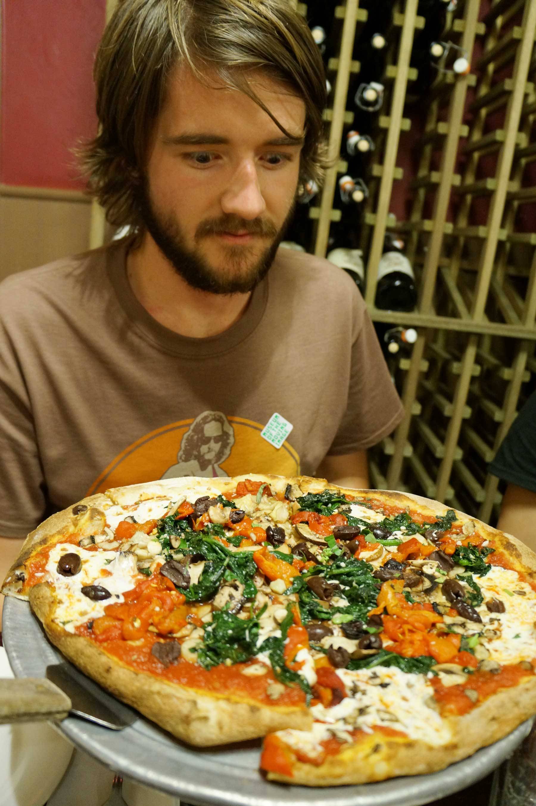 Butcher with his pizza