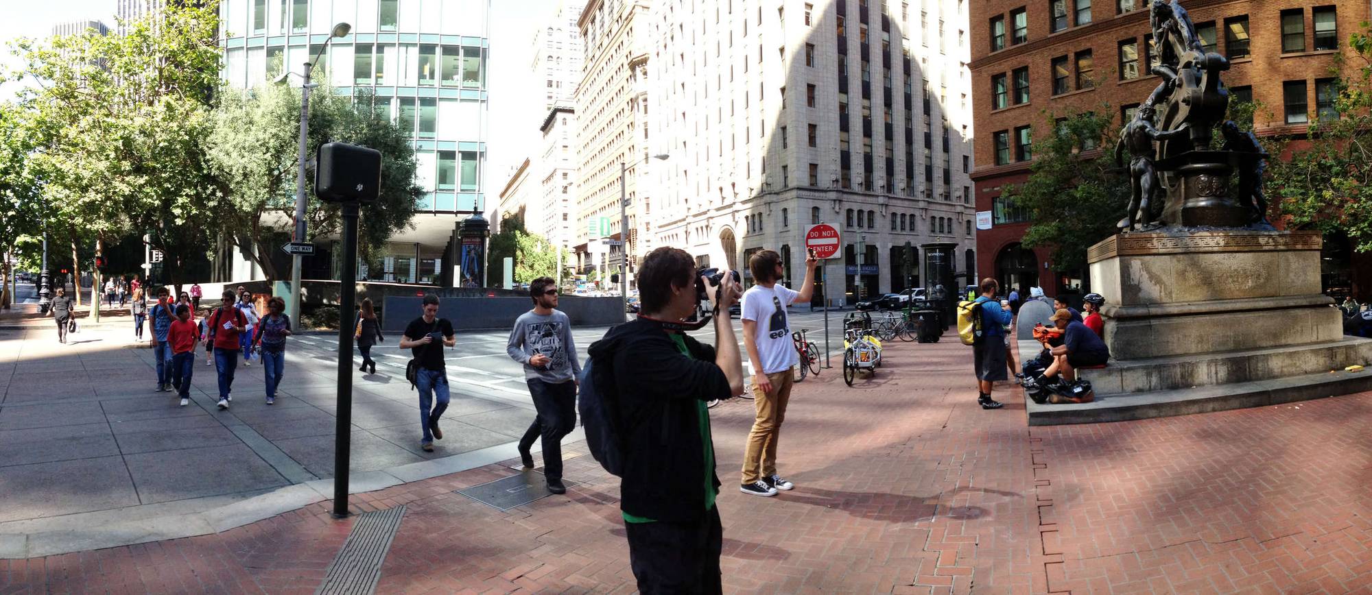 Panorama of the group taking a photo of a statue