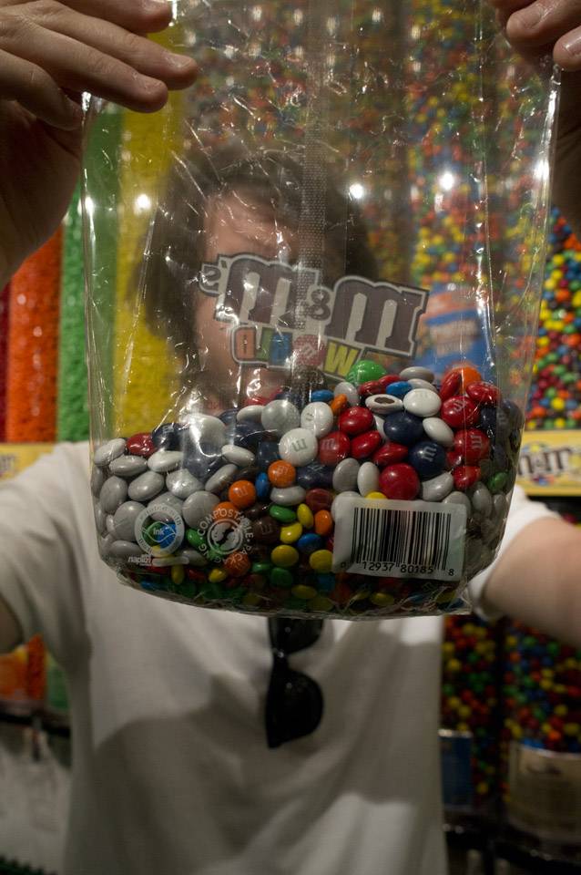 Butcher holding a bag of mixed M&M’s