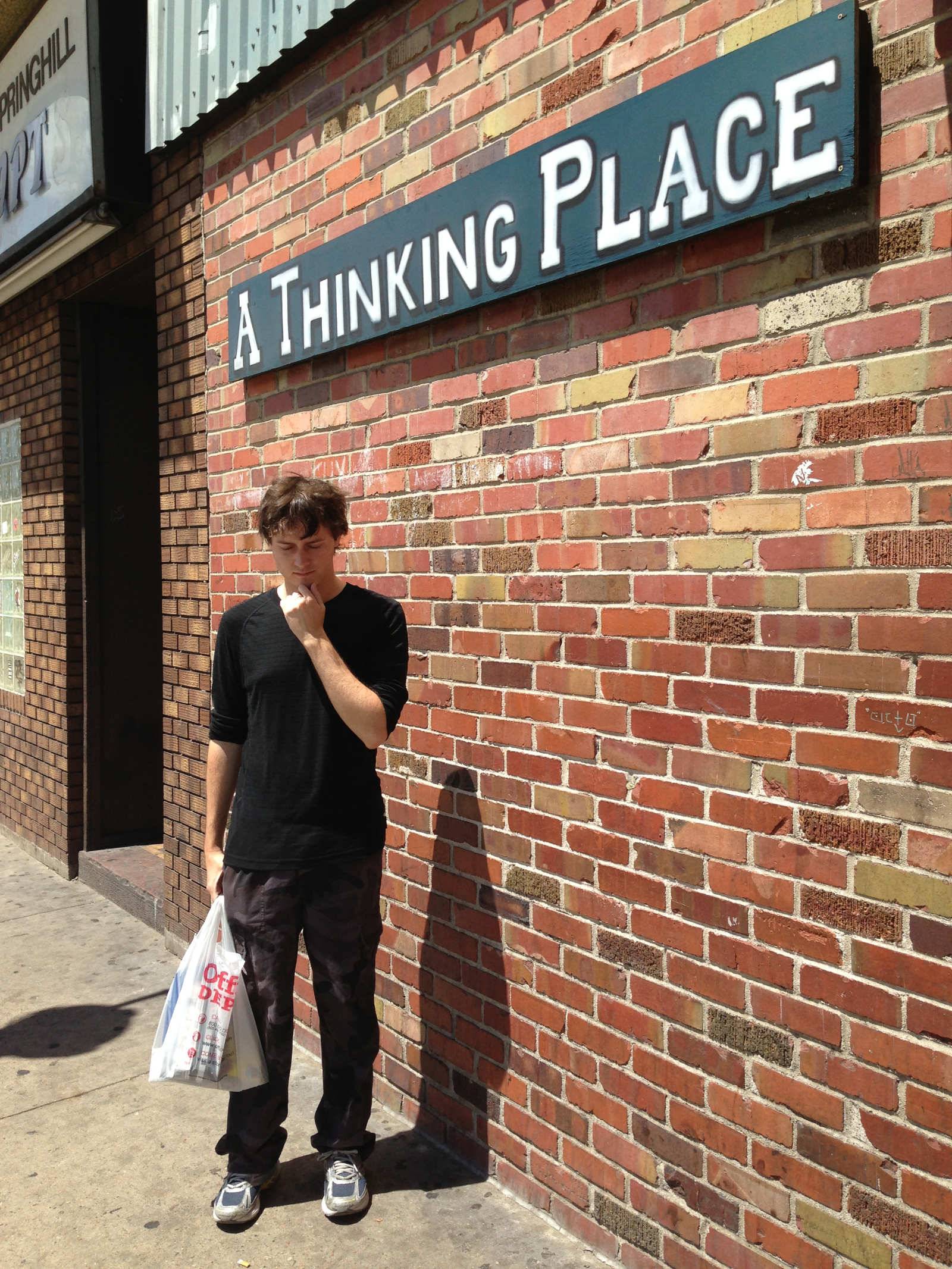 Richard outside a store called “A Thinking Place”