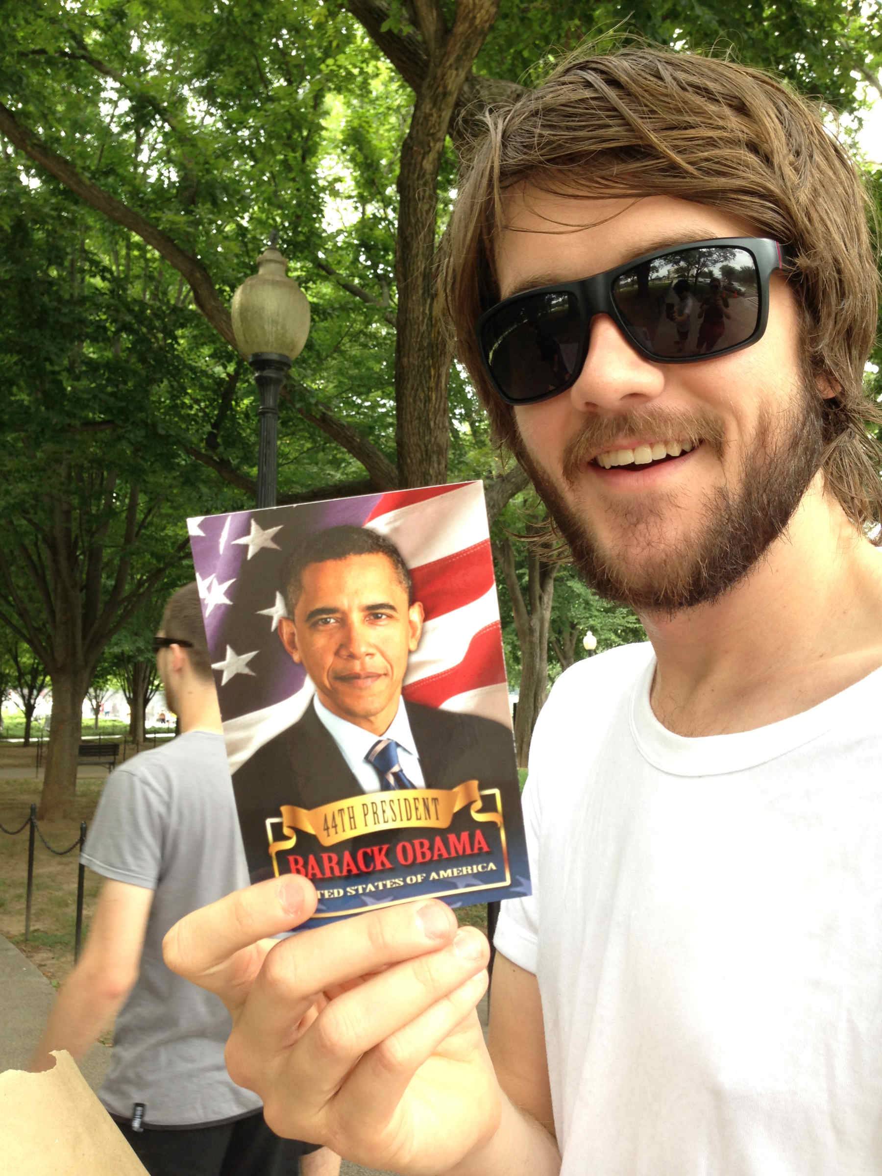 Butcher holding a Barack Obama postcard